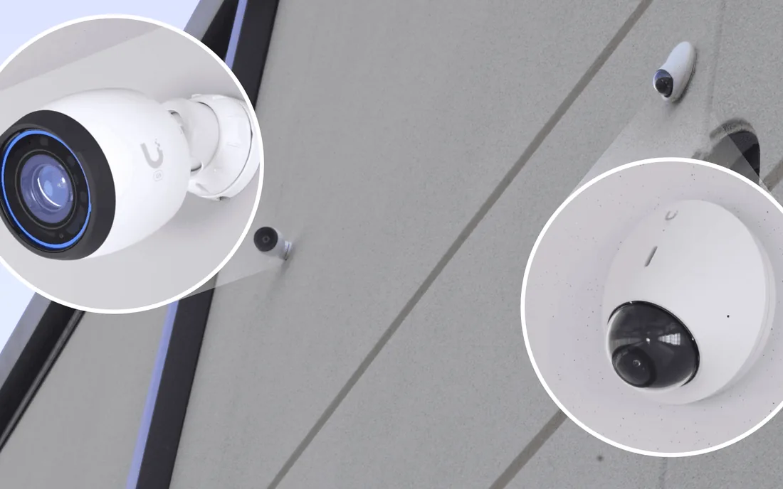 UniFi Protect bullet and dome cameras on the hangar’s exterior wall, with a close-up of each