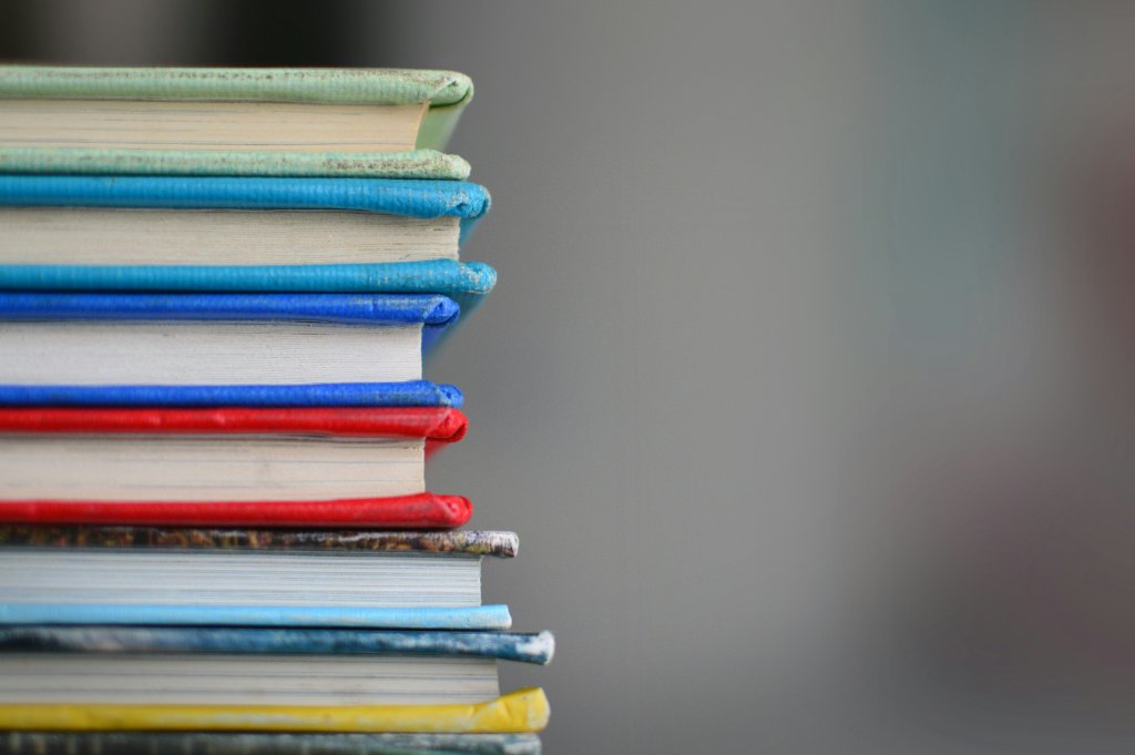 A stack of hardcover books, for the schools, colleges and nonprofits whose networks this page covers