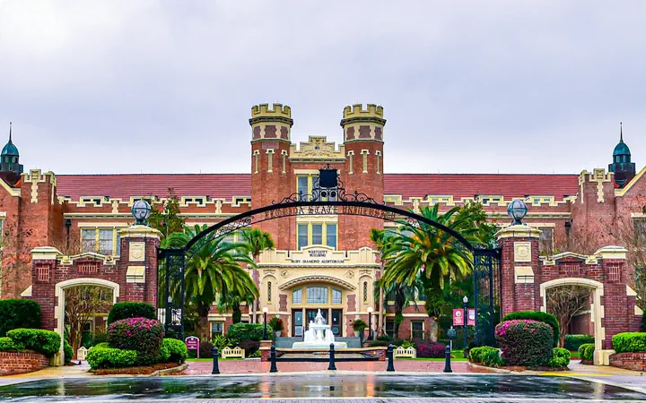 Florida State University's Westcott Building behind its gates and fountain in Tallahassee