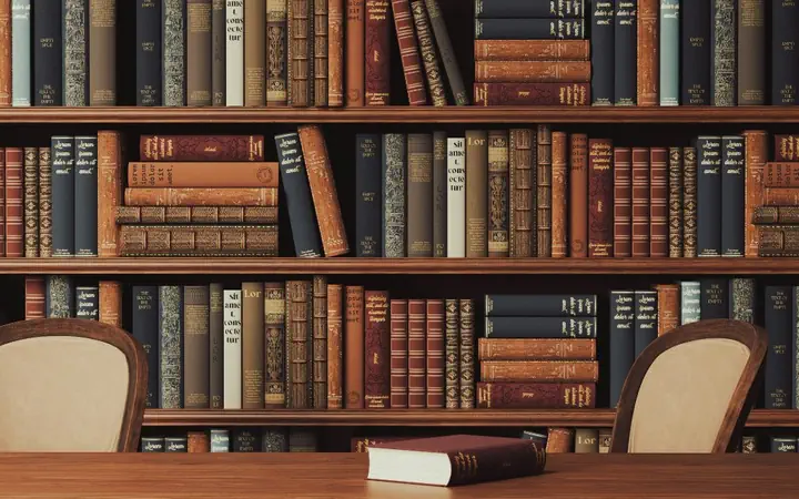A law library: shelves of bound volumes above a reading table
